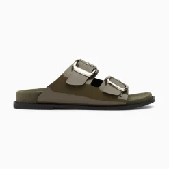 Mules Plates Celia Kaki Verni A Boucles Oversize